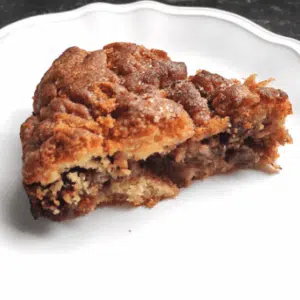 a slice of apple pie cake on a white plate