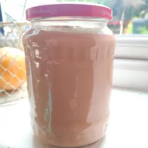 rhubarb curd in a glass jar with lid