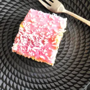 easy coconut with pink icing tray bake