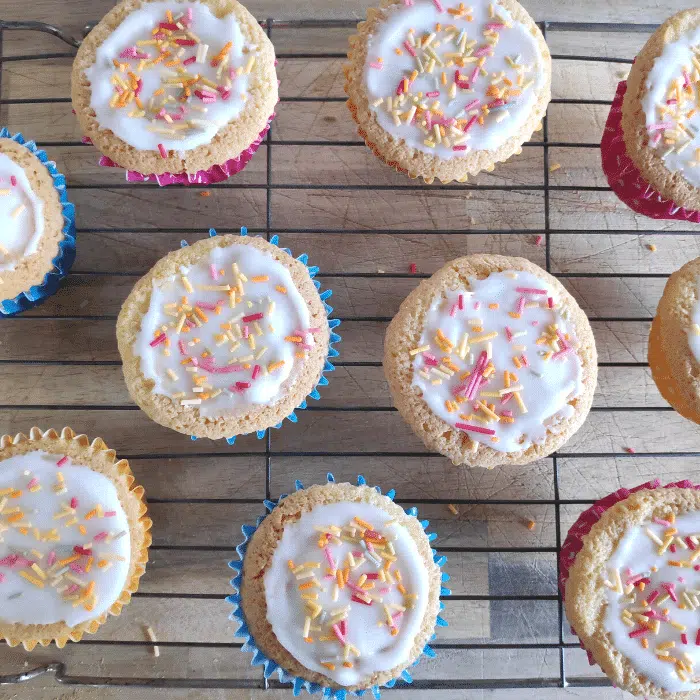 iced fairy cakes on wire rack