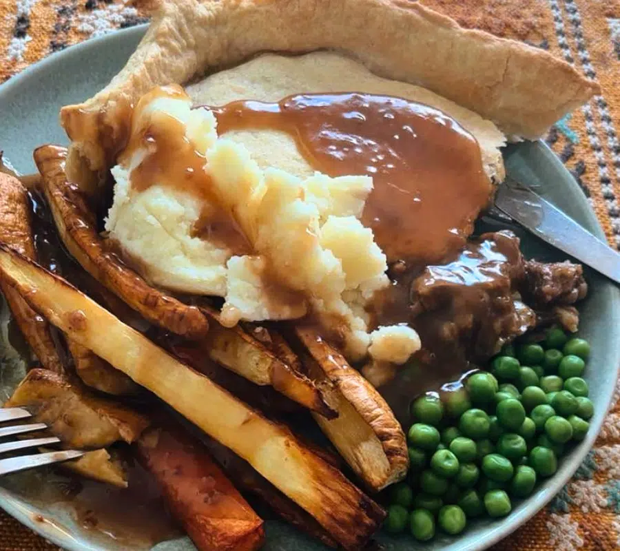 steak and kidney pie dinner at the dinner table