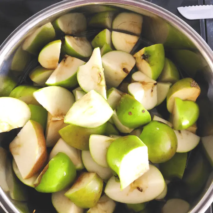 chopped apples in stainless steel pan