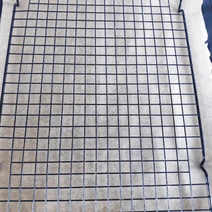 wire rack with baking paper underneath