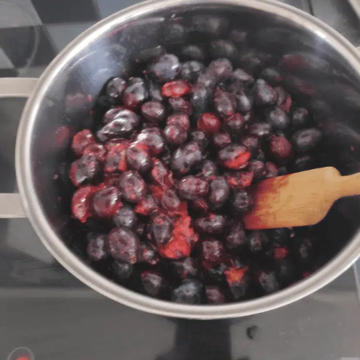 cooking damsons in stainless steel pot