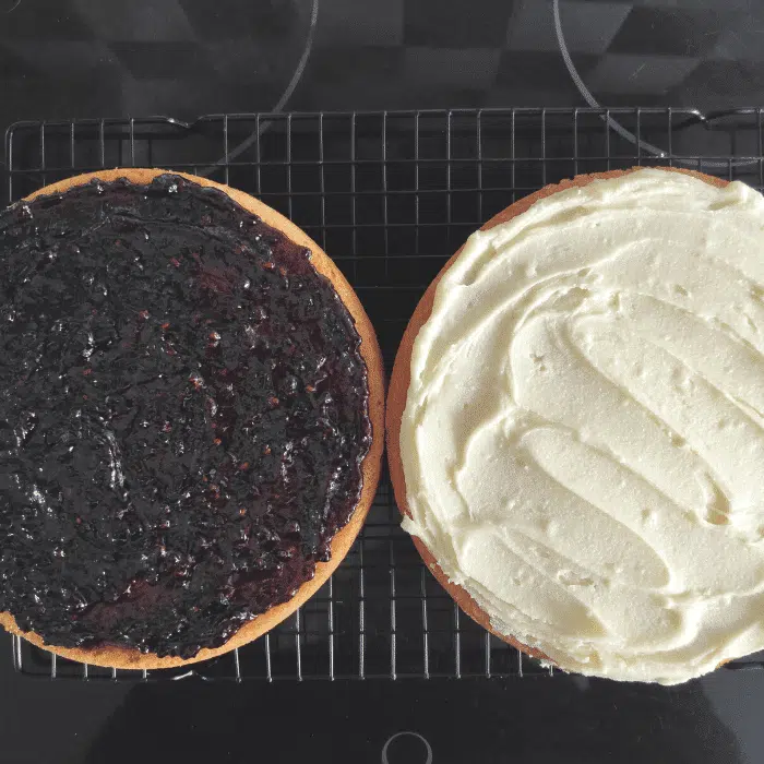 two pieces of gluten-free sponge cake one with jam one with buttercream uk recipe