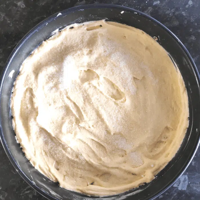 french apple cake batter in cake tin