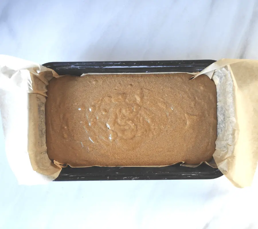 gingerbread mixture in loaf tin before baking