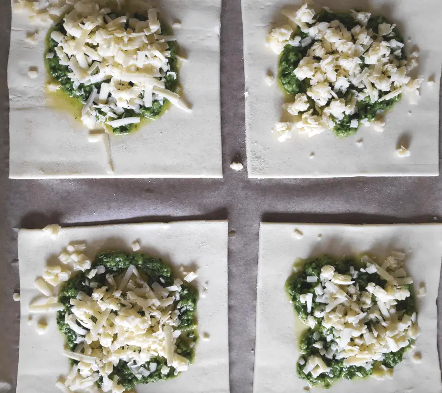 pesto and cheese on puff pastry squares