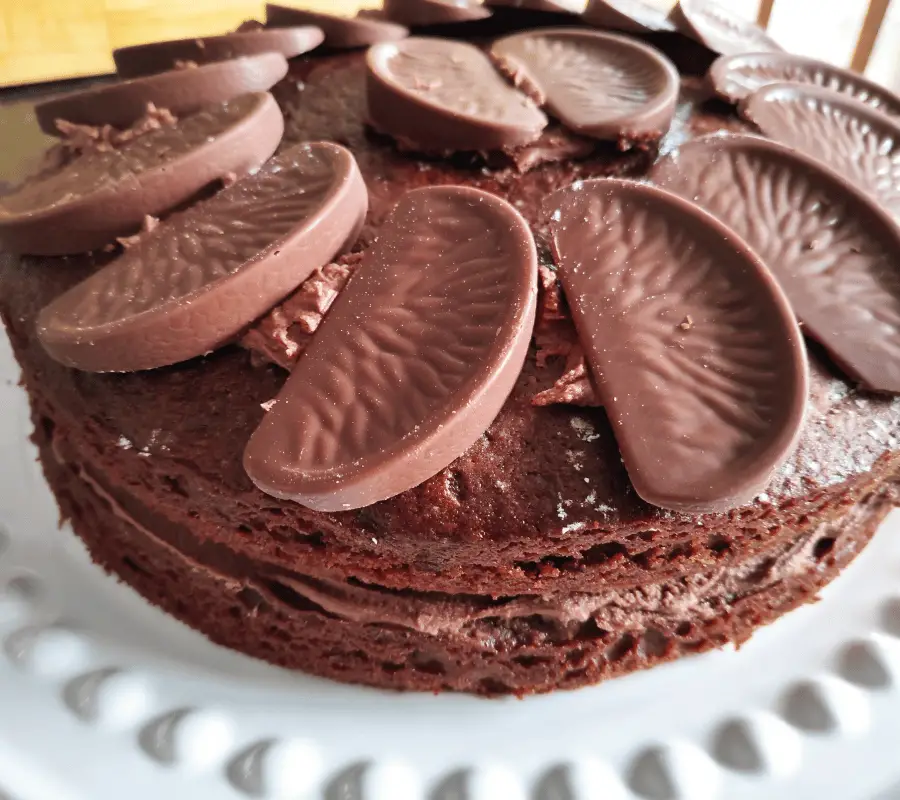 chocolate sandwich cake with terrys chocolate orange segments on top