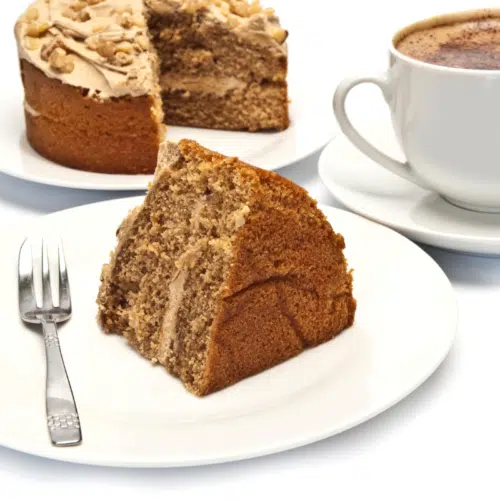 slice of coffee and walnut cake with coffee buttercream