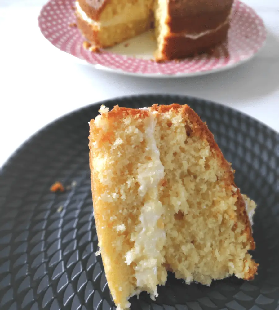 slice of coconut cake with coconut buttercream