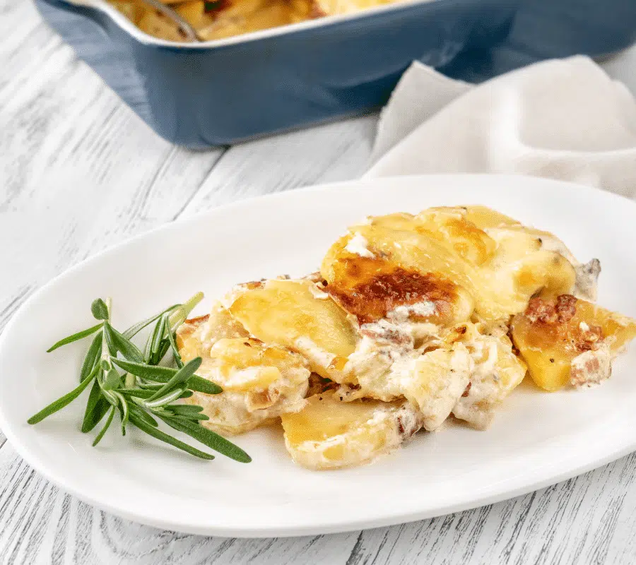 french tartiflette on white serving plate