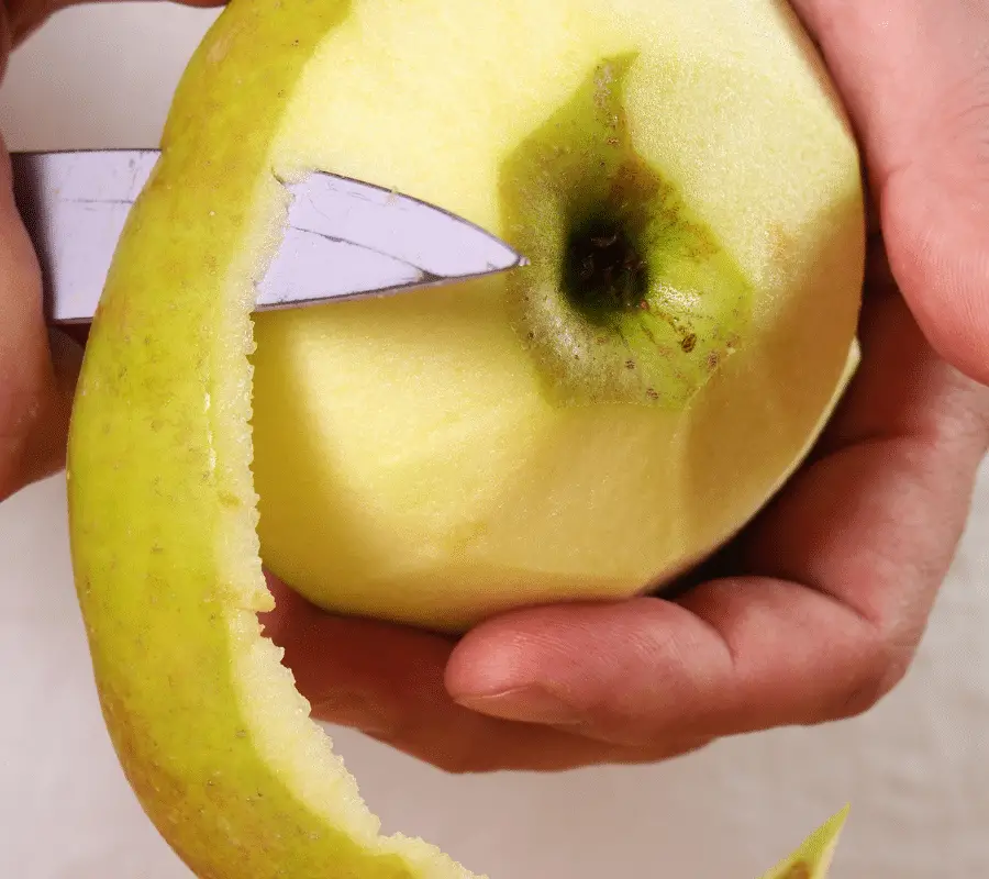 peeling apple with knife