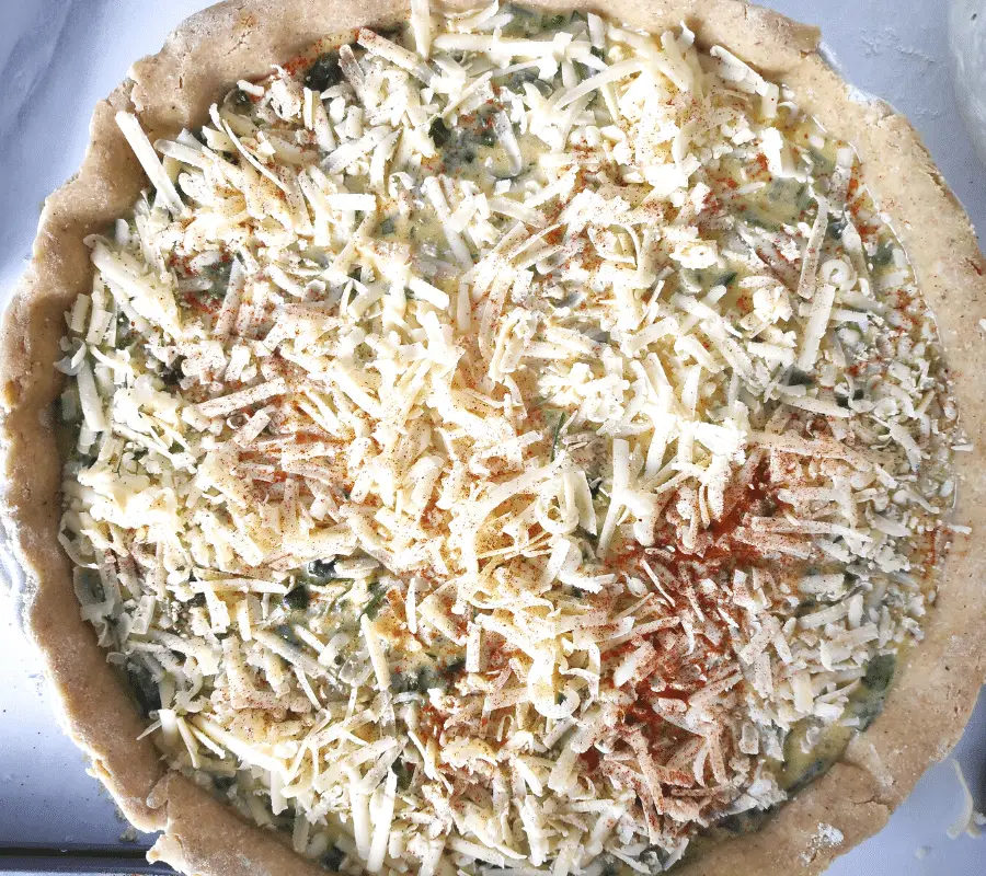 grated cheese on top of quiche