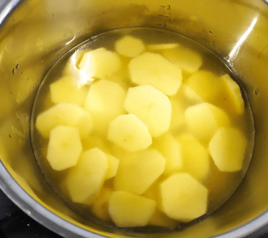 sliced potatoes in pot