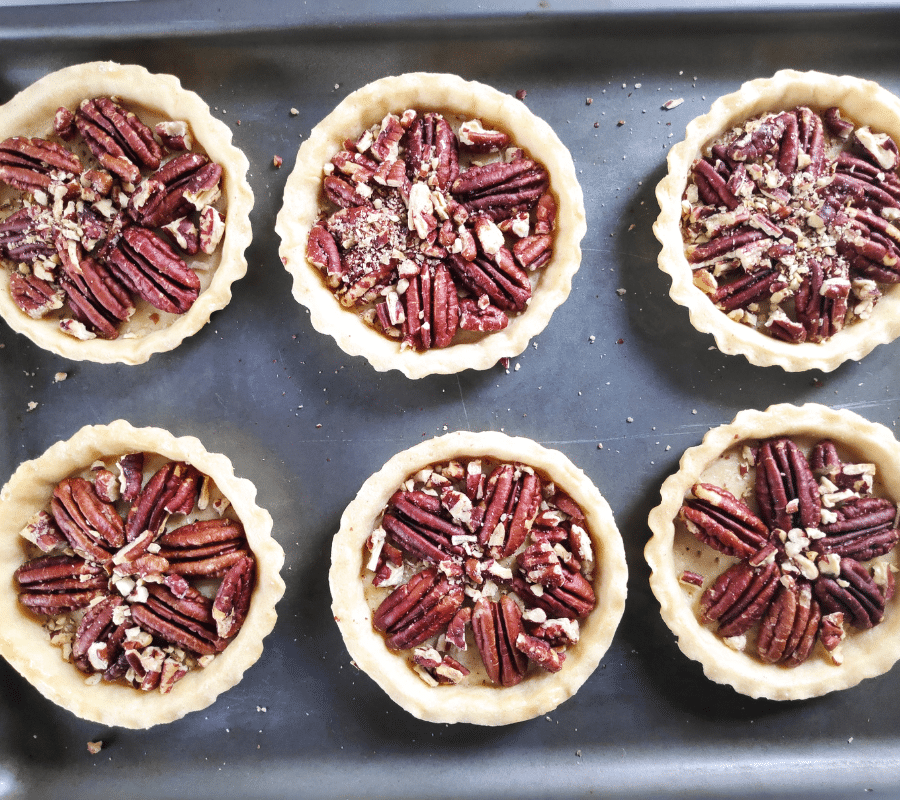 crushed pecan nuts in pastry shells