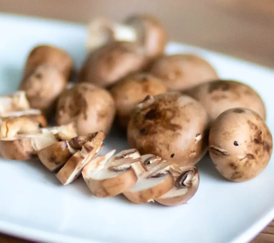 chestnut mushrooms on a white plate