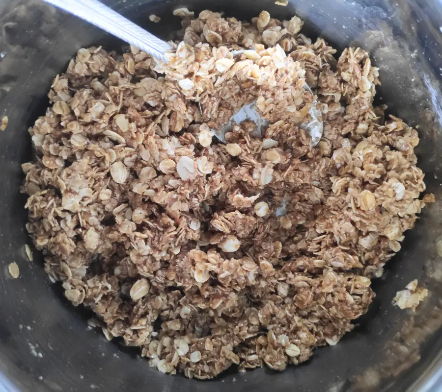 oats added to melted sugar, butter and syrup