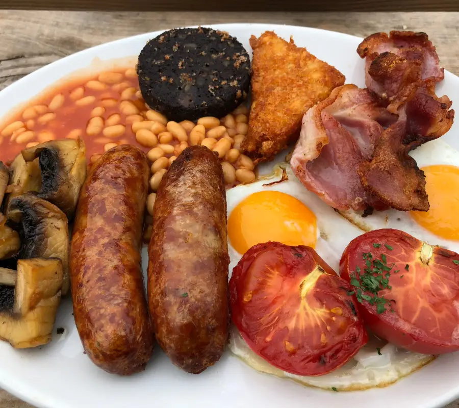 full English breakfast - sausages, bacon, tomatoes, fried eggs and mushrooms, baked beans, black pudding and hash brown.