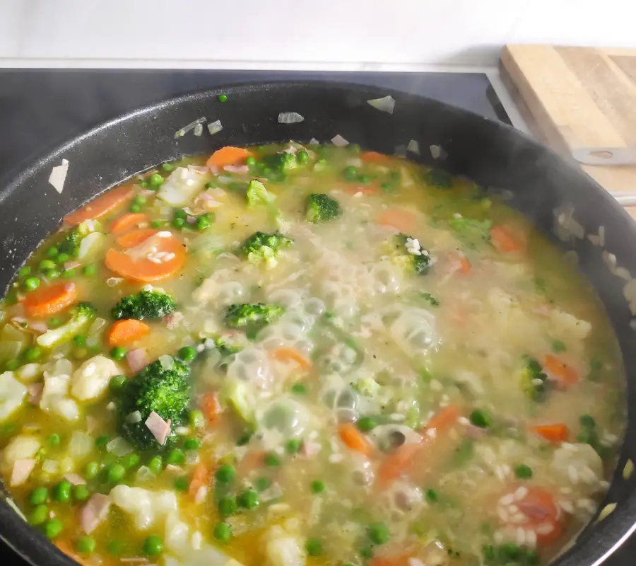 veggie risotto cooking in a pan