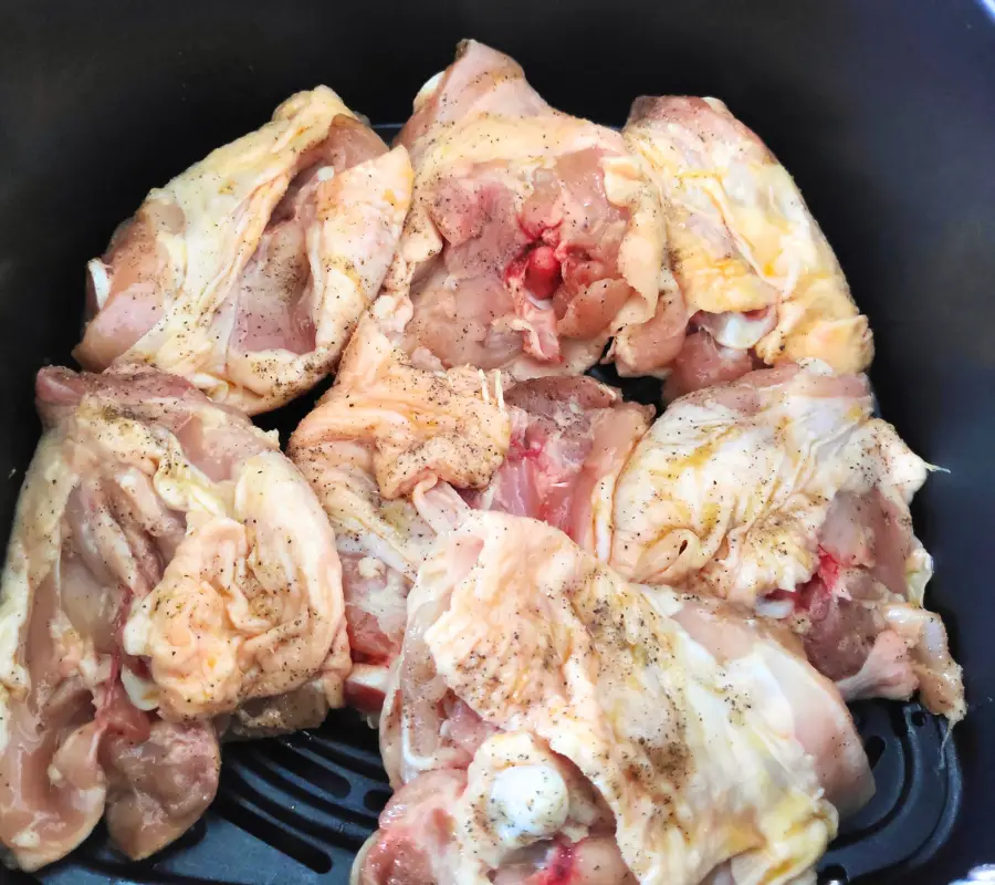 chicken thighs with bone skin faced down in air fryer