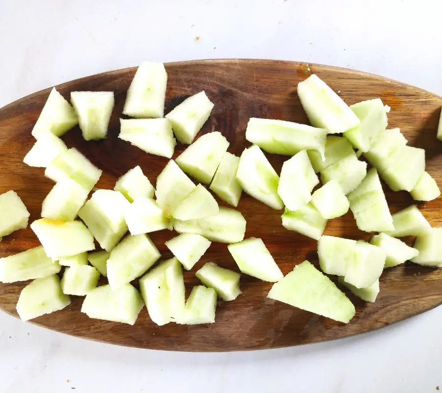 chopped apple on chopping board