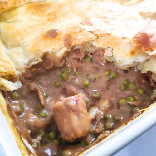 sausage curry pie topped with puff pastry