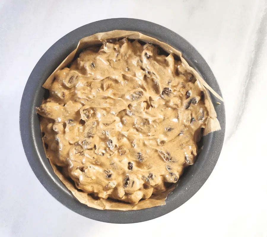 Christmas cake mixture in a tin