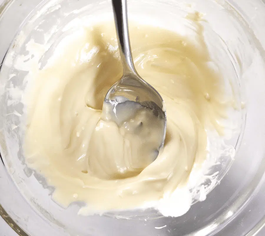 melted wite chocolate in a clear bowl