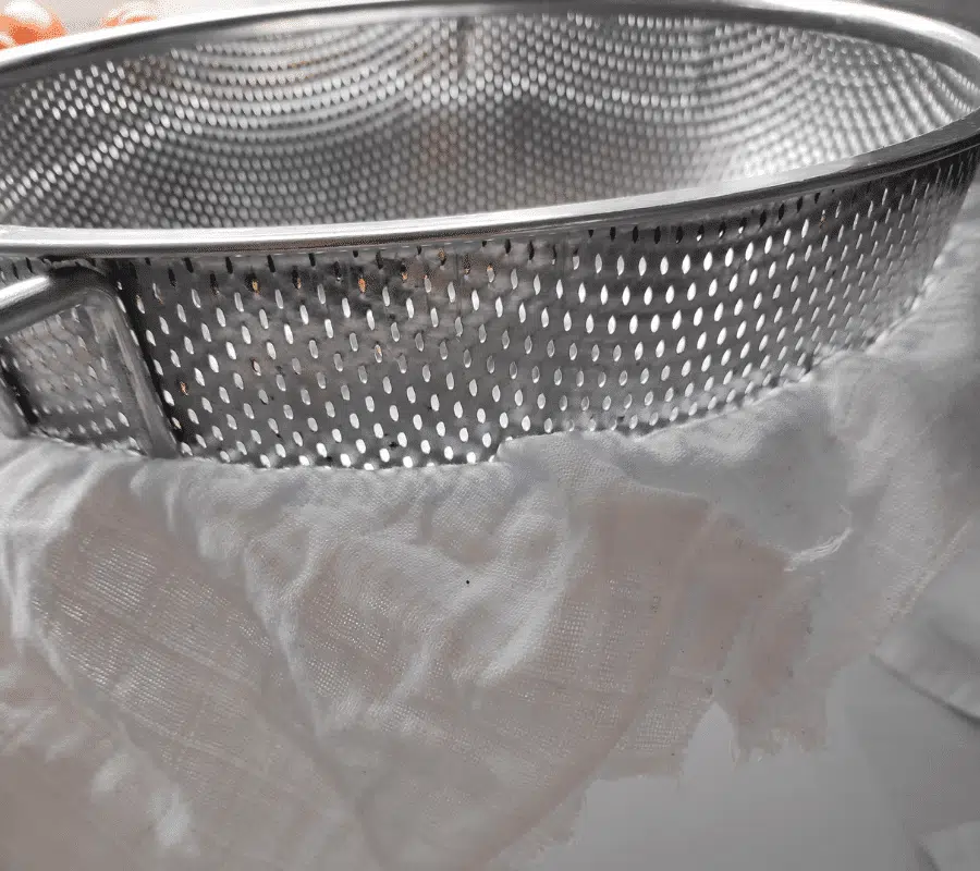 sieve and muslin cloth over bowl