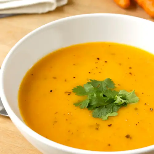 carrot and coriander soup in a white bowl mary berrys recipe uk