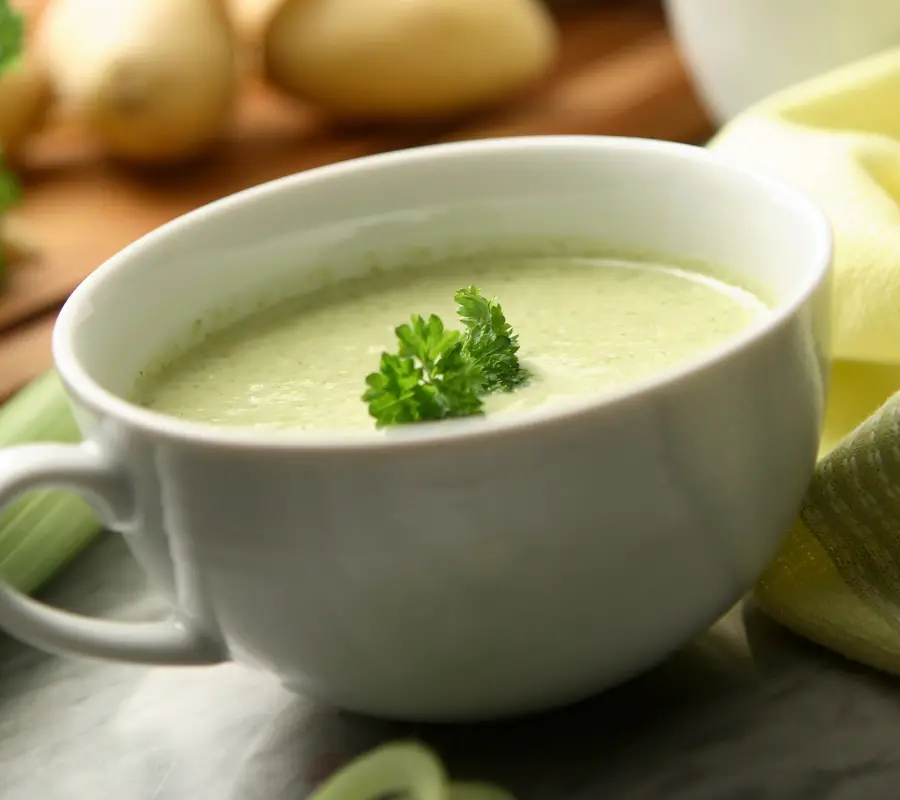 leek and potato soup in a white bowl
