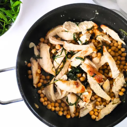 high protein garlic chicken and chick pea in a pan