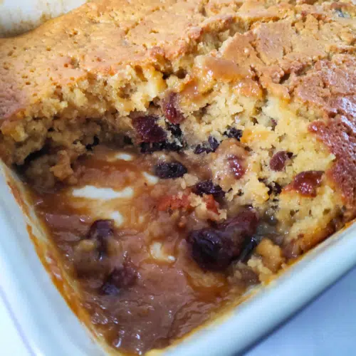 rum and raising sponge pudding in a oven proof dish