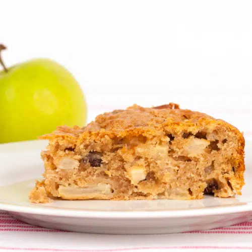 a slice of dorset apple cake on a white plate