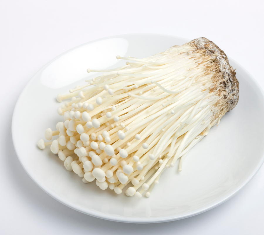 enoki mushrooms on a white plate