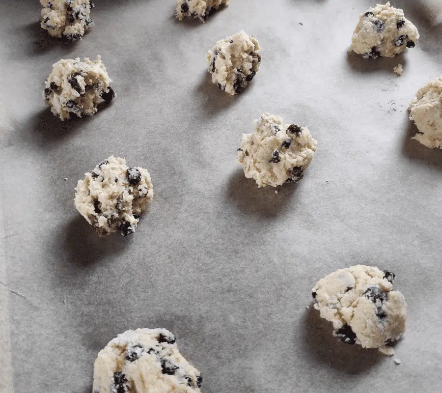 unbaked rock cakes on a large baking tray