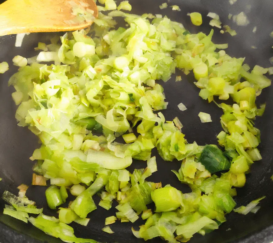 leeks frying in a pan