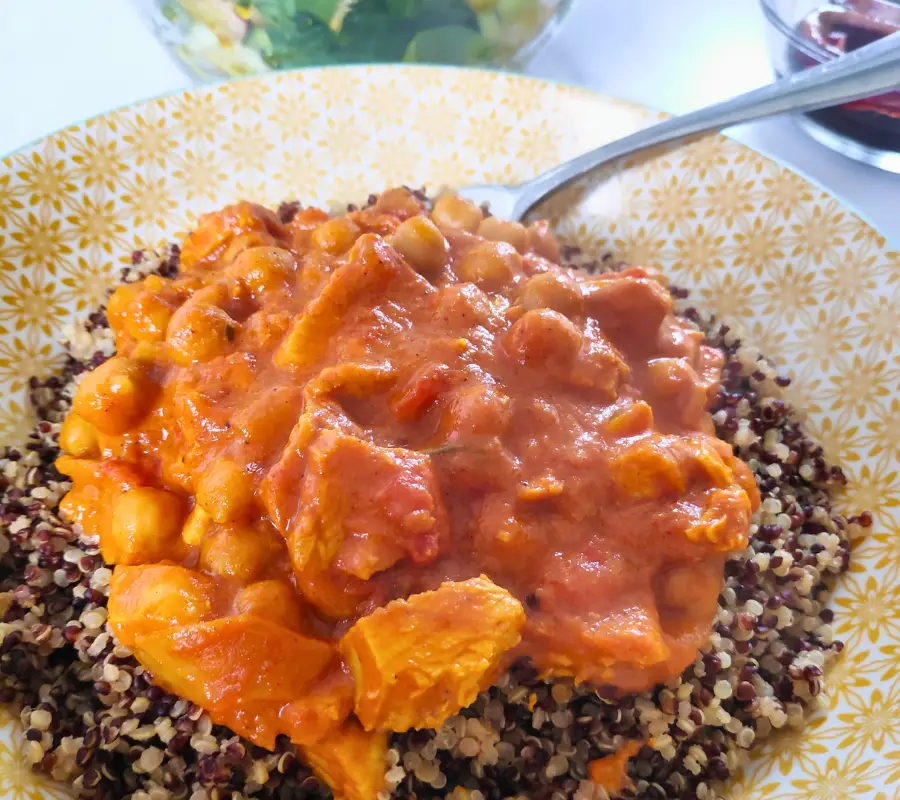 turkey curry with chickpea on a bed of quinoa in a bowl