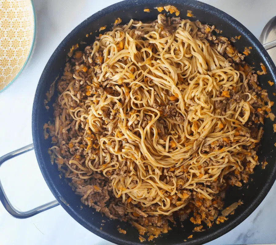 ork mince noodles in a large pan