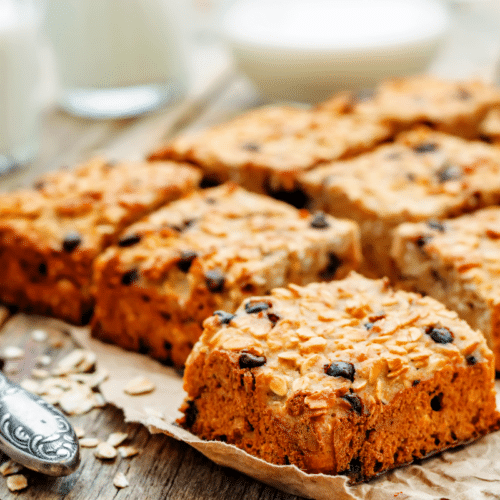 chocolate chip oat bars cut into squares on baking paper
