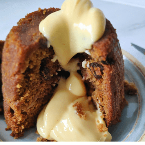 apple and cinnamon pudding topped with custard