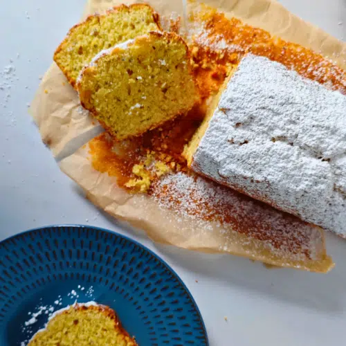 sliced kiwi and lime loaf cake on baking paper
