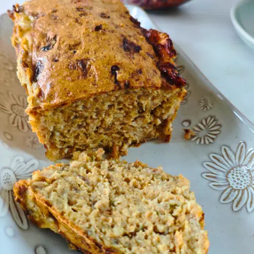 chicken mince meatloaf sliced on a white plate