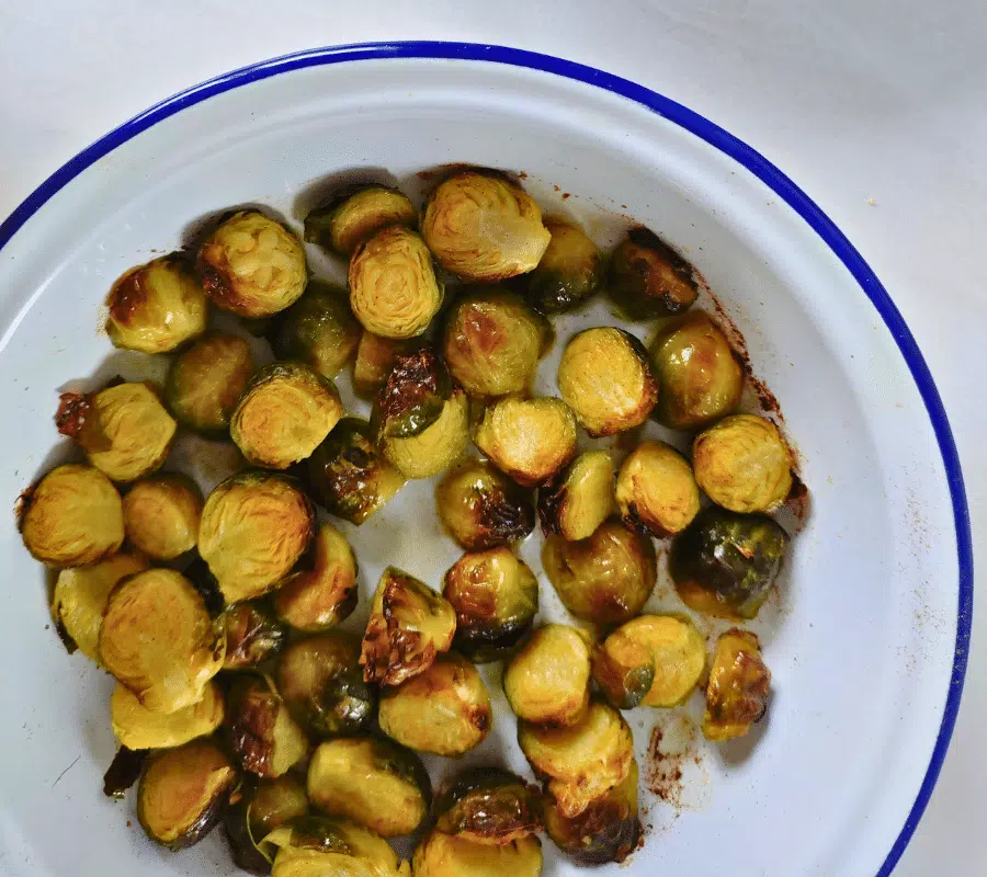 roasted sprouts in a white round dish