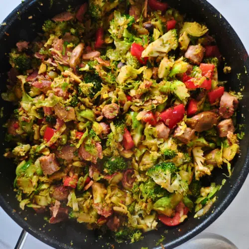 sausage, bacon, sprouts broccoli stirfry in a pan