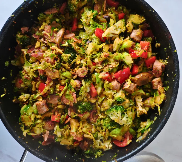sausage, bacon, sprouts broccoli stirfry in a pan