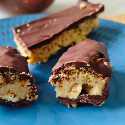 homemade nutty chocolate bars on a blue plate