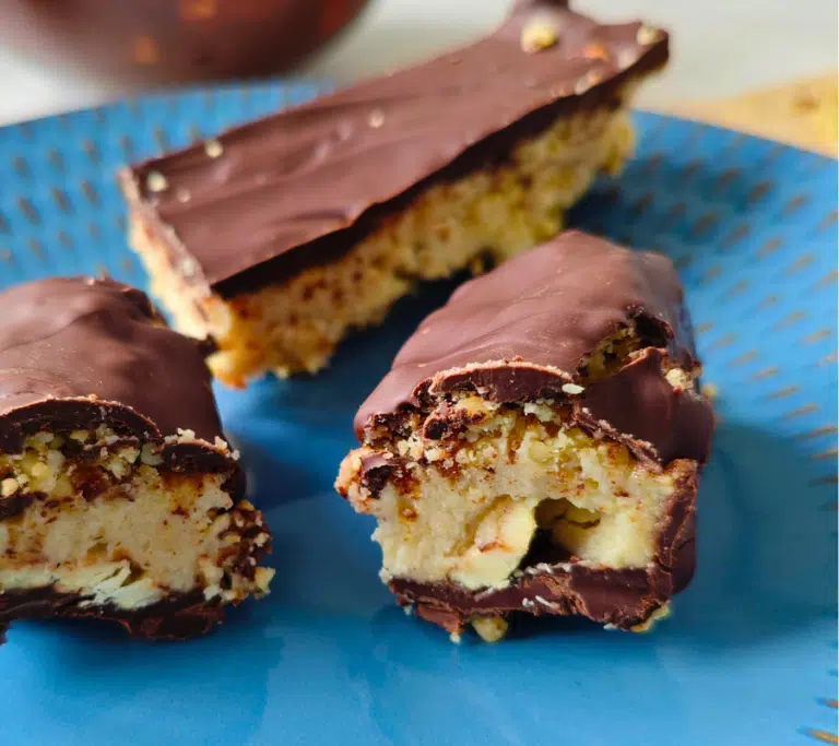 homemade nutty chocolate bars on a blue plate