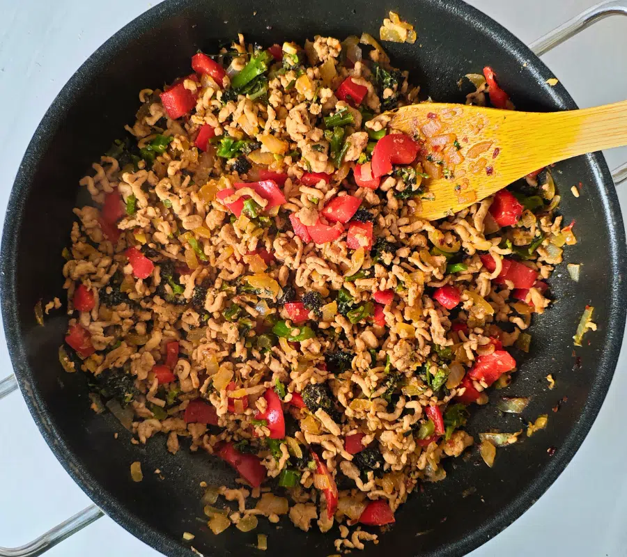 stir fry thai pork mince in a frying pan